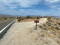 No shooting or fires sign shows location of the Carrizo Badlands Overlook unpaved access road.