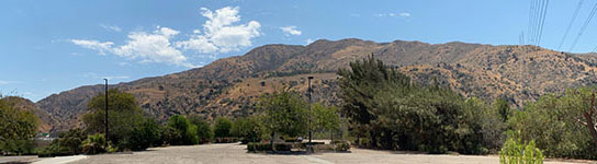 Panoramic view looking north from the parking lot of the Fairview Golf Course toward the faulted mountain front of the north end of the Santa Ana Mountains on the south side of the Santa Ana River Canyon.