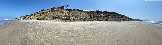 Panoramic view of the sea cliff (Delmar Formation below, Bay Point Formation, above to left. North is to to left; south is to the right.