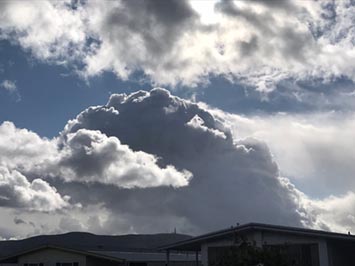 Altocumulus cloud building into a cumulonimbus cloud over Double Peak, San Marcos, California
