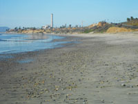 Sand and gravel deposits accumulation on Carlsbad Beach in southern California.