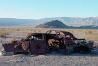 Rusty cars in the desert.