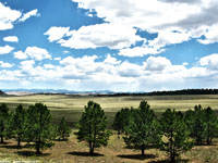 Rolling hill country around Limon, Colorado with the Colorado Front Range in the distance. 