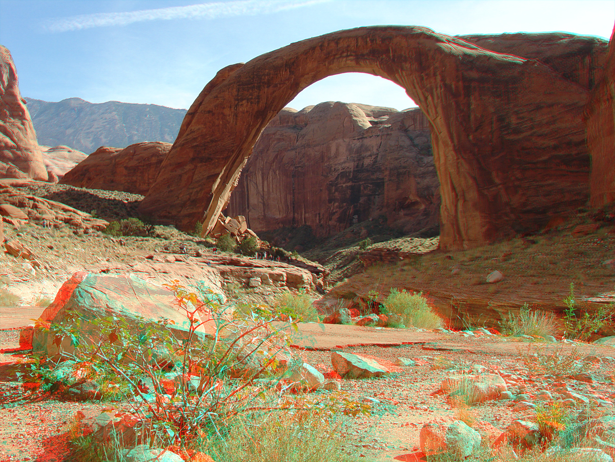 Rainbow Bridge in afternnon light with Navajo Mountain in the distance