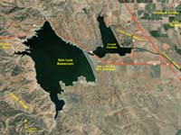Satellive view of the massive San Luis Reservoir, dam, forebay and aqueducts on the east side of the Diablo Range in Central California near Los Banos.