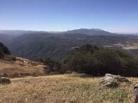 View looking south from near the top of Volcan Mountain. High peaks of the Cuyamaca Mountains are in the distance.