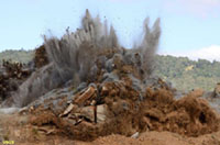 Explosive blasting is one of many ways human break down large quantities of rocks in mines and construction sites.