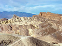 Death Valley view from Zabriski Point area showing tectonically uplifted and tilted sedimentary layers that were valley-fill deposits that accumulated only a few million year previously.