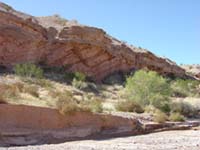 A resistent layer of caliche exposed in a caprock surface along an incised creek channel in Lake Mead National Recreation Area, Nevada.