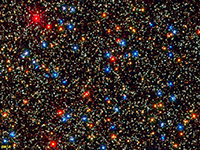 Colorful stars in a massive cluster in the Omega Centari region.