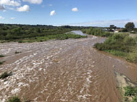 The San Luis Rey River in flood in April, 2020 in Oceanside, California.