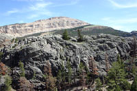 Dipping outcrops of Paleozoic strata on unstratified granite in Torrey Canyon, Wyomin