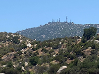 Zoom view of the summit of Woodson Mountain as seen from Lake Ramona Dam.