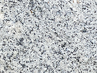 White granite (tonalite) in boulder on Lake Ramona Dam.