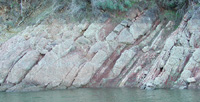 Sandstone, shale, and conglomerate exposed along Anderson Reservoir's shoreline