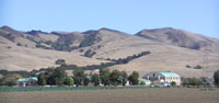 Hogback ridge of Lomitas Muertas beyond Anzar High School in San Juan Valley
