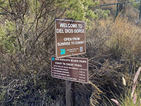 A sign showing mileage to selected destinations along the Coast To Crest Trail.