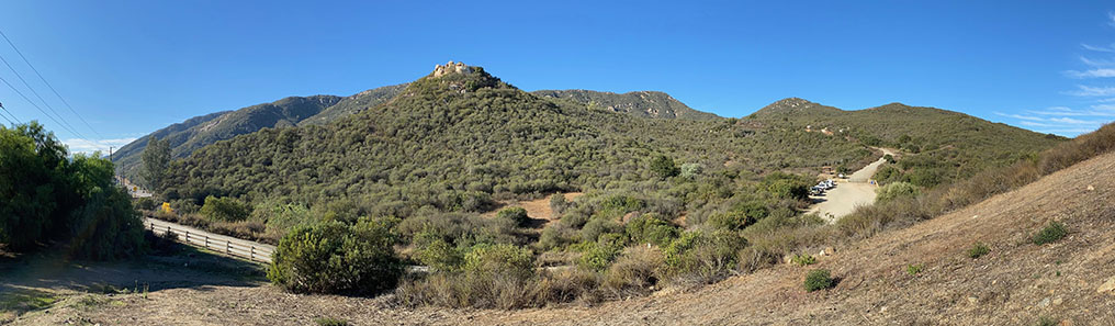 Wide angle view of the chaparral covered mountain landscape of the Del Dios Preserve from a location ntear the Del Dios Highlands trailhead parking lot.