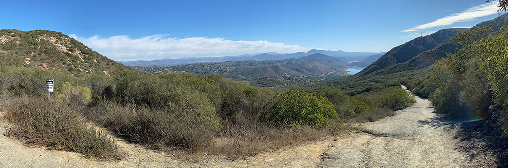 A wide angle view looking down the Del Dios Trail into the valley host to Lake Hodges. The view is from a slightly higer perspective than the previous image.