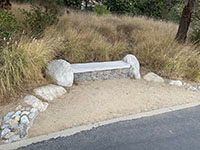 Stone bench along the Discovery Creek Trail