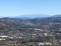 Zoomed-in view of the crest of the San Bernardino Mountains rising over the crest of the northern end of the Peninsular Ranges.