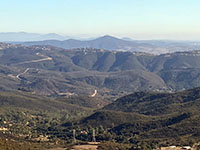 Zoomed-in view of Black Mountain with the ridgeline of the Elfin Forest Recreational Reserve in the foreground.