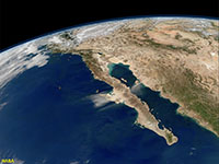 A satellite view looking down at the west coast of Mexico extending northward into the southwestern United State region centered showing Baja California and the Peninsular Ranges.