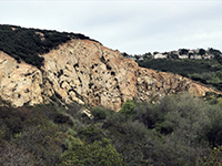 View of a large outcrop of granitic rock exposed along San Marcos Creek near Melrose Avenue.