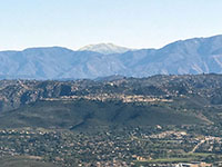 Zoomed-in view of the summit area of San Jacinto Peak rising above the northern end of Palomar Mountain and mountains of the northern Peninsular Ranges.