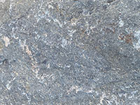 Close up view of a piece of gray, fine-grained andesite.