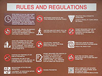 Sign showing the rules and regulations regarding access and activities in the Elfin Forest Recreational Reserve.