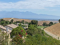 View looking north along Chino Fault valley above Alterra Park with distant San Bernardino Mountains.