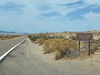 Sign for the unpaved Dolomite Mine Road along Highway S2 south of the Carrizo Badlands and Coyote Mountains overlooks.