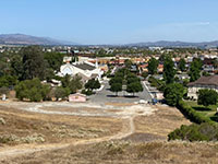 View north toward distant valley of the Elsinore Trough from hilltop near Duck Pond Park. Santa Ana mountains are in the distance to the left. Temescal Hills are on the distant right.