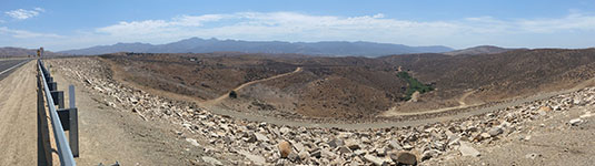 View looking west from Lake Mathews Dam across the erosion surface level on top of the Perris tectonic block. Santa Ana Mountains are in the distance, west of the Elsinore Trough (valley).