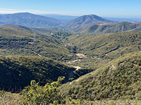 View of the chaparral-covered hillsides along Questhaven Canyon from the overlook at end of Spur Trail.