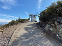 View of the radio tower on top of Franks Peak from along the paved road.