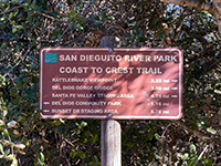 Trail mileage sign for Coast to Crest Trail near Hernandez Hideaway.