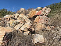 Fire-scortched boulders on the Mid-Valley Mesa near an old mine shaft.