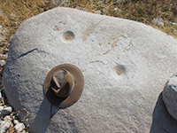 Prehistoric grinding mortars on a granite boulder along the south shore of Lake Hodges.