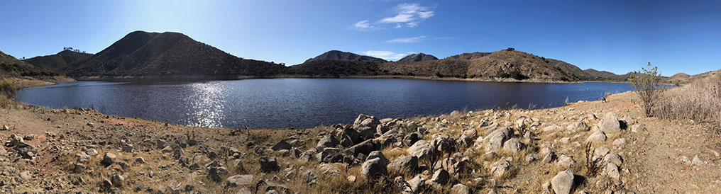 Panoramic view of the rocky shoreline of lake hodges with the Fletcher Point Peninsula on the opposite side of the bay.