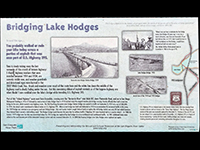 Sign telling the story about the history of bridges over Lake Hodges.