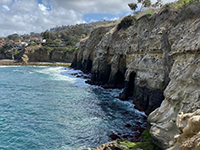 View of sea cliffs and the mouths of sea caves as seen east of Goldfish Point.