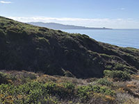 View looking south from Torrey Pines Mesa toward La Jolla showing the Pleistocene-age step-like marine terraces on the west side of Mount Soledad.