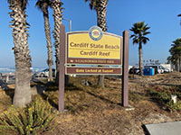 Sign for Cardiff State Beach and the Cardiff Reef surfing area.