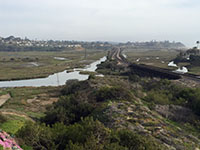View looking south from San Elijo Avenue towards the railroad causeway where it crosses the lagoon.