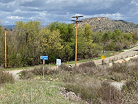 The road intersection sign stands out at the intersection of Highland Valley Road and Sycamore Canyon Road.