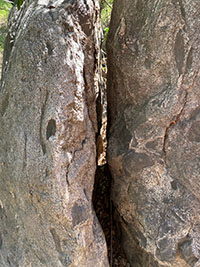 A large boulder appear split down the middle.