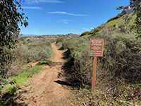 Important wildlife corridor sign near the trailhead for the Highland Valley Trail.