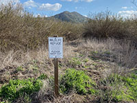Wildlife refuge sign for restored riparian habitat along the Mule Hill Trail.